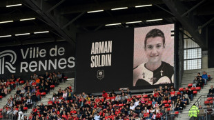 French club hold emotional tribute for slain AFP reporter