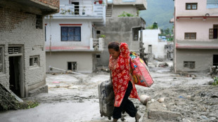 Rescuers claw through mud as missing toll from Nepal, China flood nears 3,000