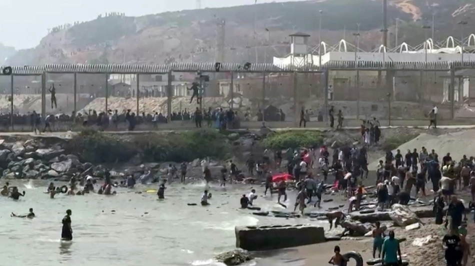 Hundreds of migrants flood into Spain's Ceuta exclave from Morocco