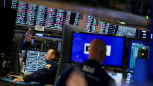 Wall Street termine sans direction claire, mitigée après la Fed