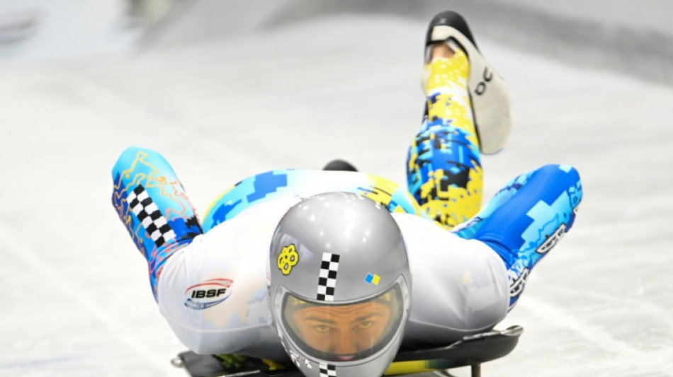 Ukrainian flag bearer proud to show his country is still standing