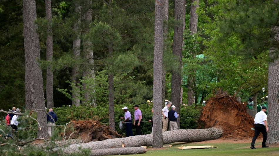 Rahm lurks as delayed Masters second round resumes