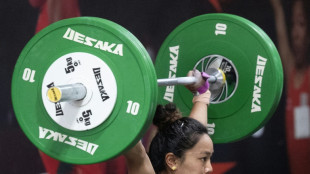 India trailblazer won't 'let go' of chance for Asian weightlifting glory